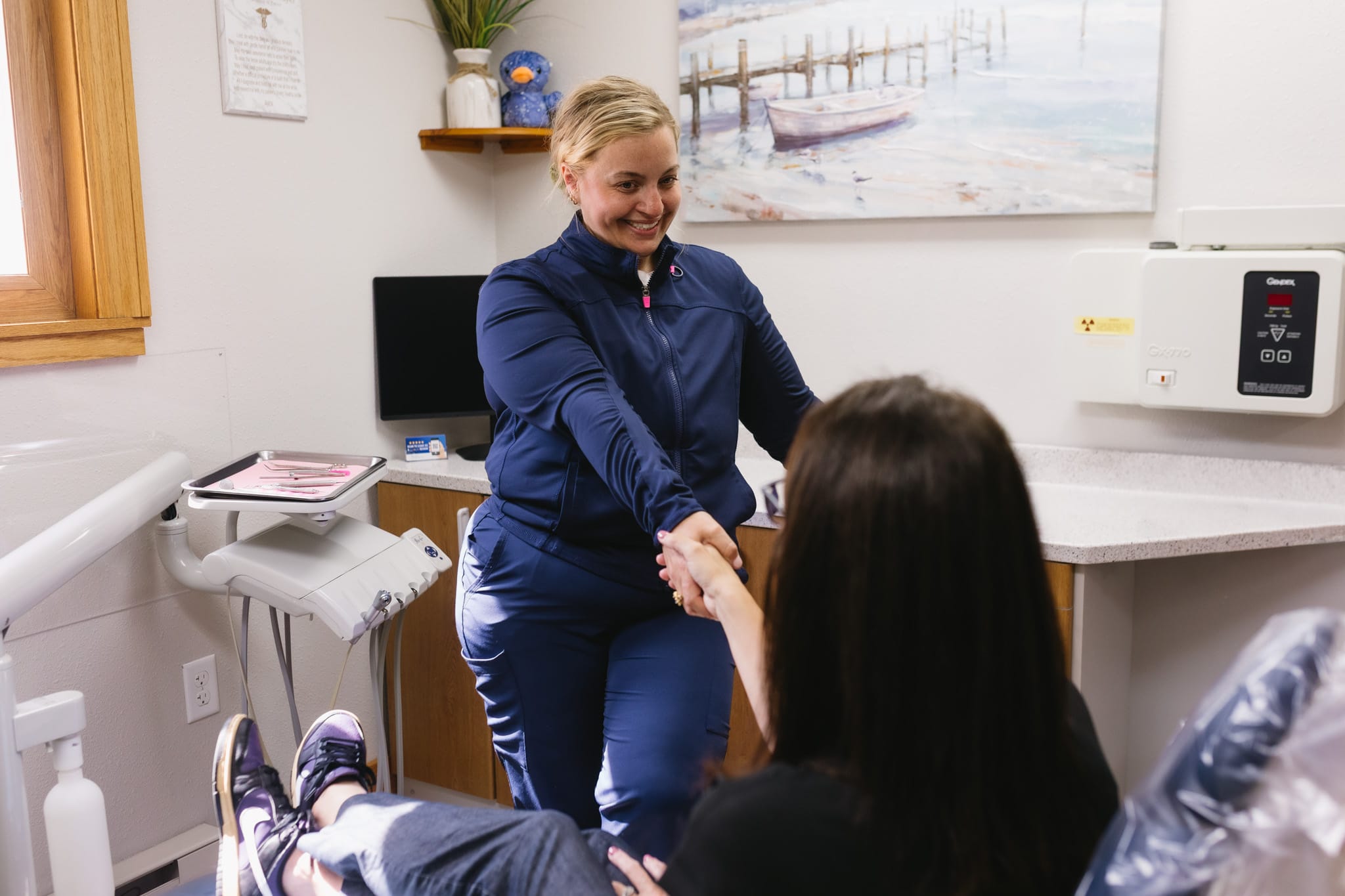 Dr. Bethany Taylor talking with a patient at Haven Dental in Toledo, Ohio